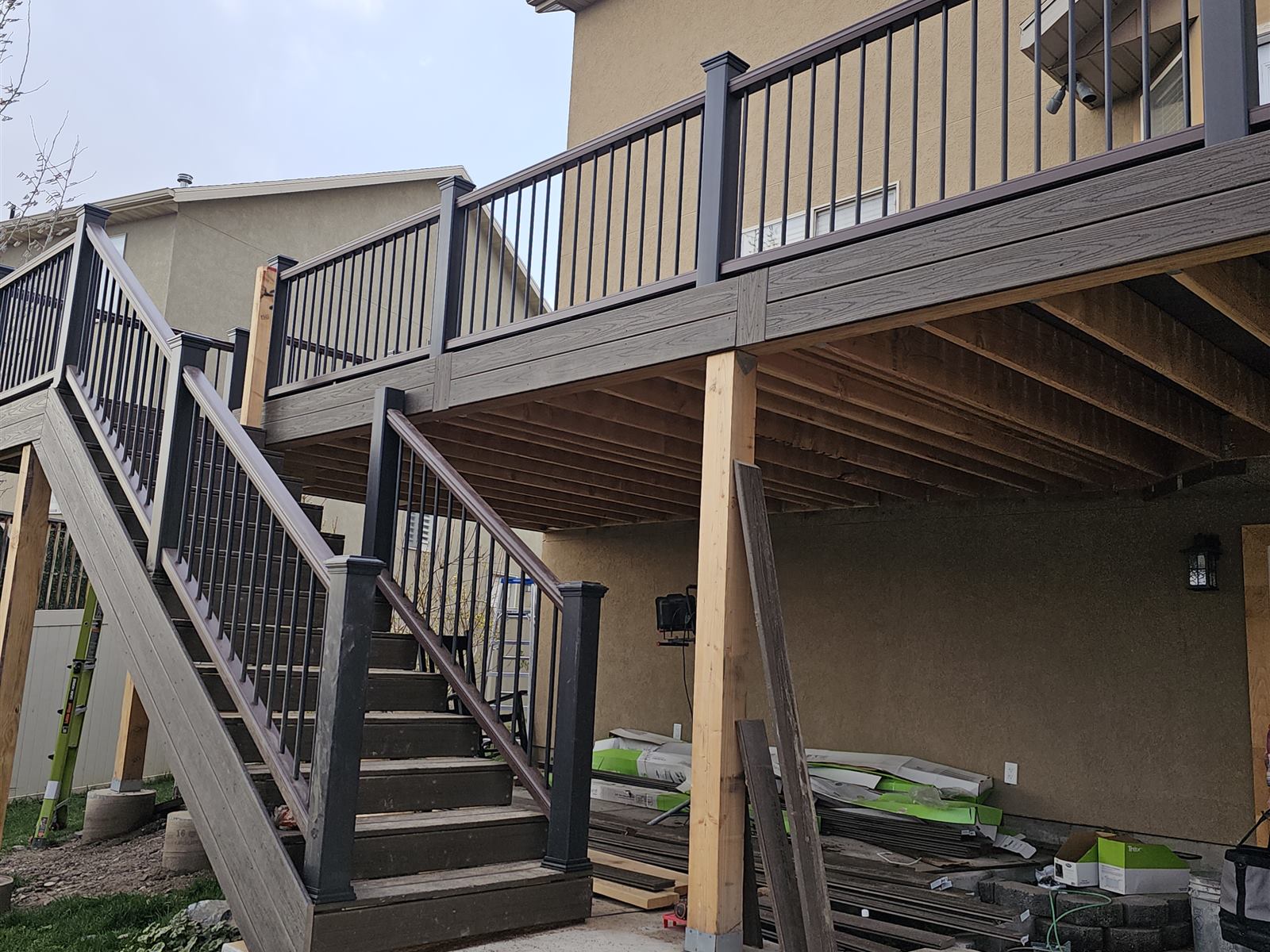 Finished composite deck stairs and two-tone railing