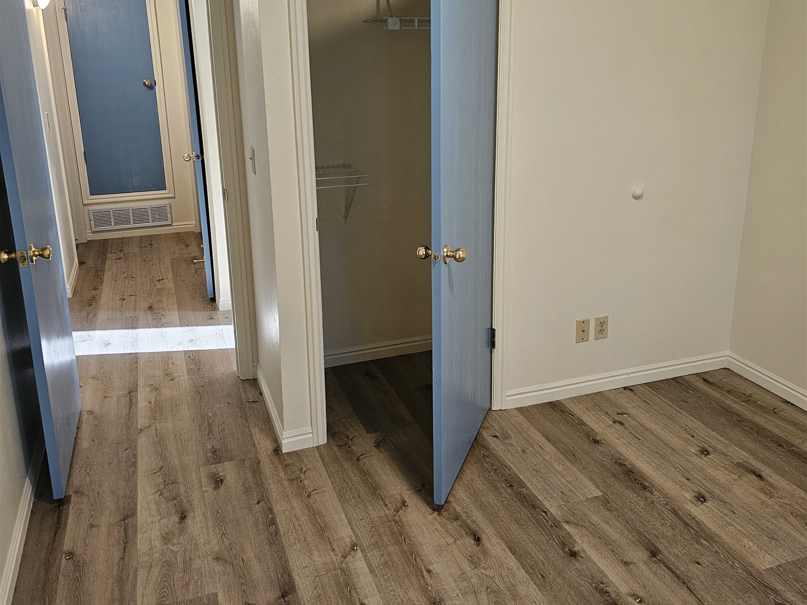 Hallway refresh with repainted doors and new luxury vinyl plank flooring