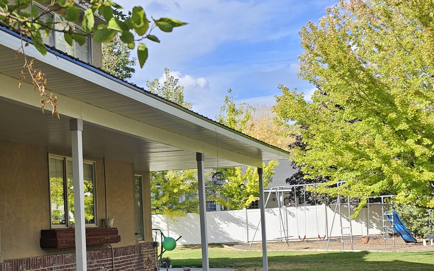 New covered patio with wrapped posts built onto a Utah home